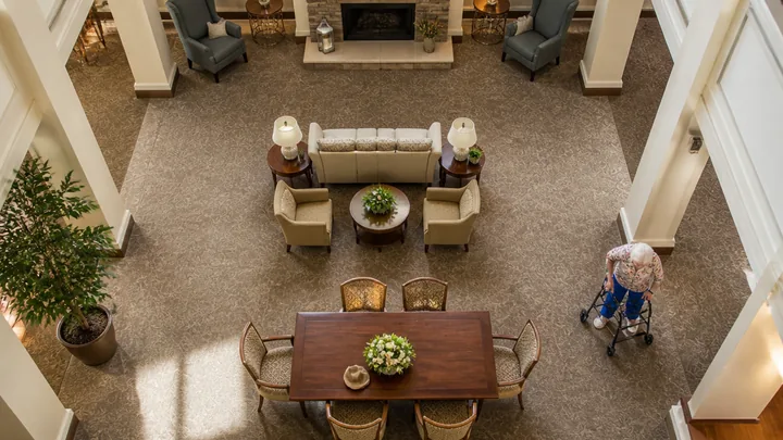 Overhead view of a lobby staged with fresh flowers and seating